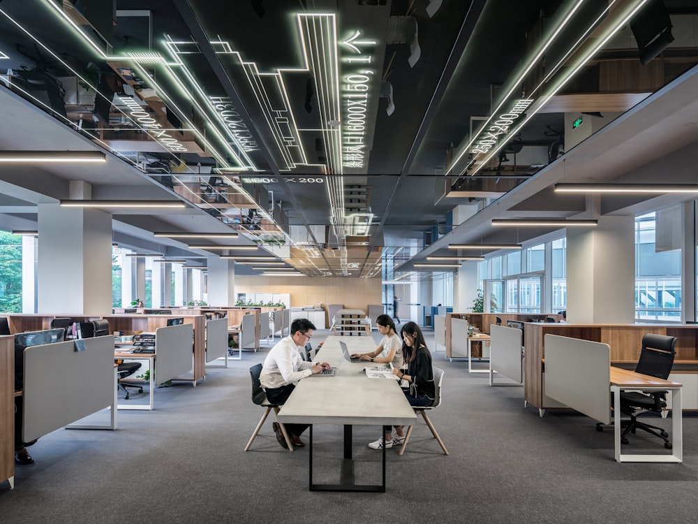 A modern open plan office with employees working at desks